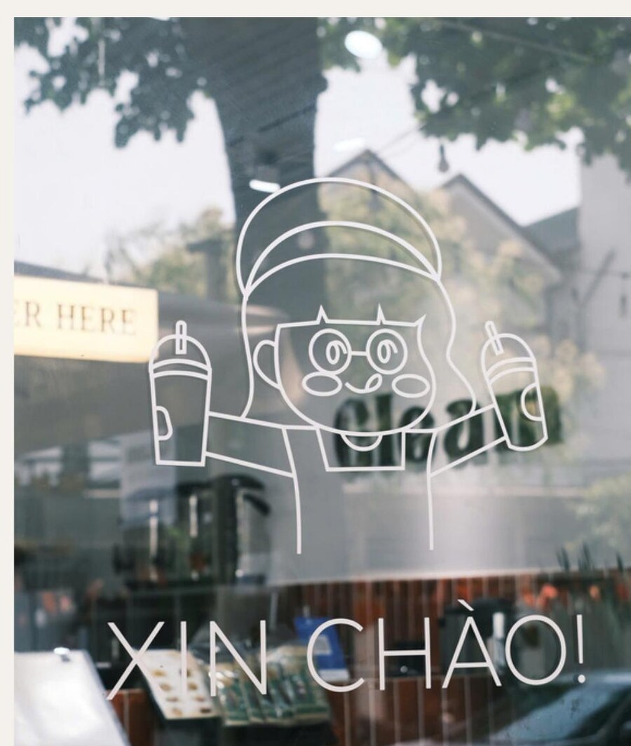Gleam window vinyl with the mascot and Xin Chào